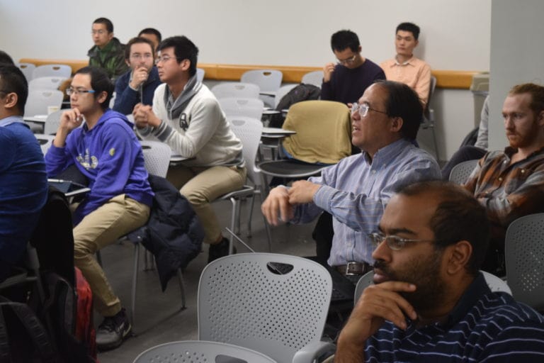 People Concentrating In front of them in the Quantum Matter Workshop